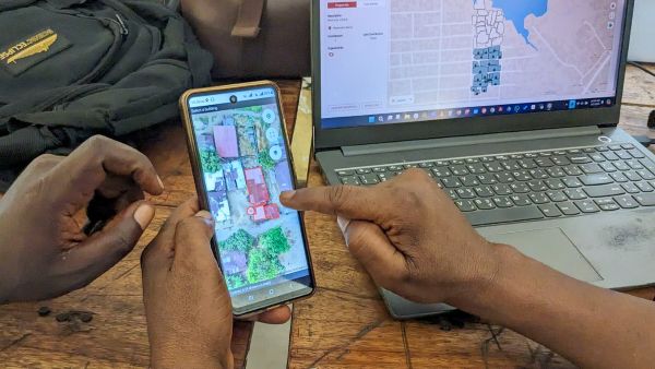 A project manager demonstrates FieldTM mapping workflow on a laptop